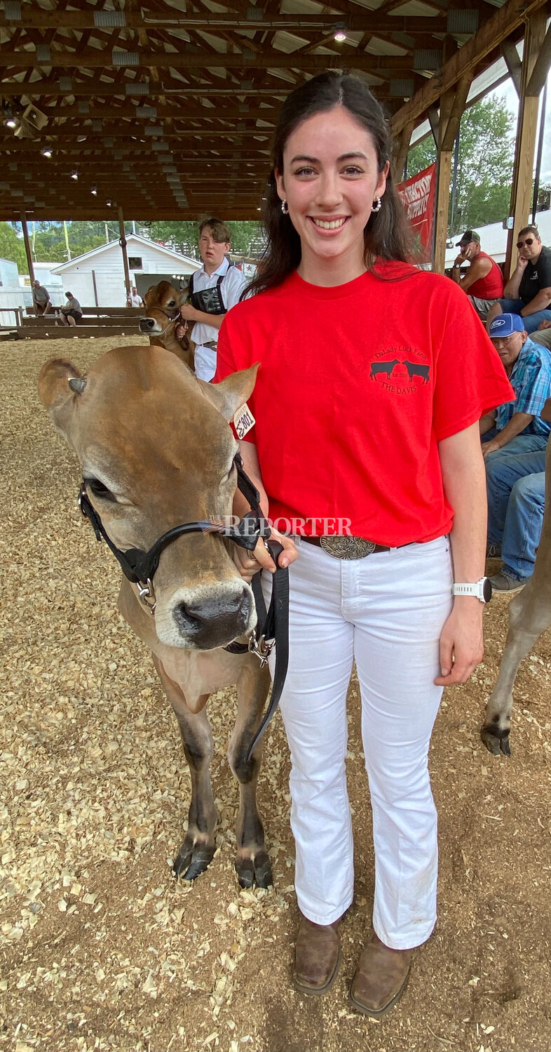 Chloe Davis of South Kortright earns first place in Sunday’s Open Jersey Parish Show in the youth division of the fall calf class, with her calf OMG.